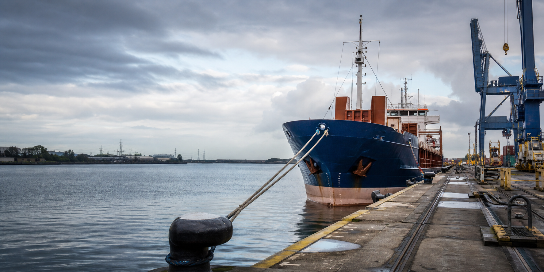 Cargo vessel secured alongside a working port quay